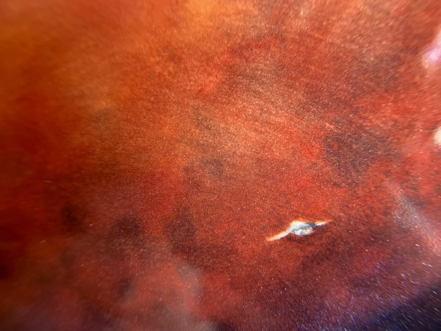 Detail of plate featuring a ship flying toward a red planet